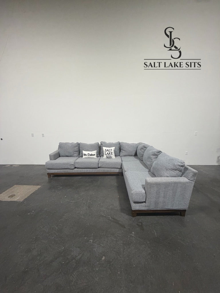 Gray L-Shaped Sectional with Wood Base