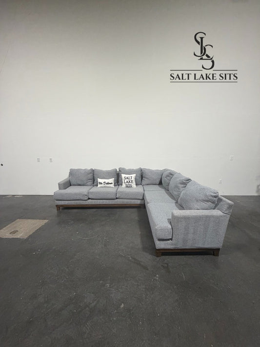 Gray L-Shaped Sectional with Wood Base